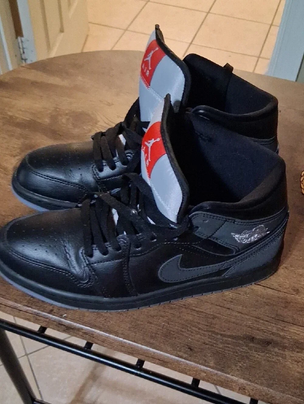 Jordan Black High-Top Sneakers with Red Tongue Patch